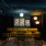 Yellow velet couch with modern art