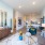 Open-concept living room with view of kitchen at Savoy apartments for rent in Uptown Charlotte.