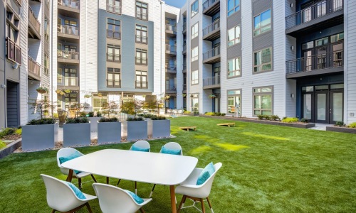 White table and chairs in courtyard